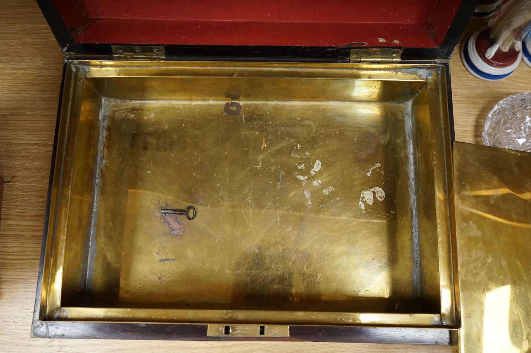 A Regency brass bound mahogany travelling tobacco box, coat of arms to centre, the inner brass cover with cedar wood lining 42.5cm wide